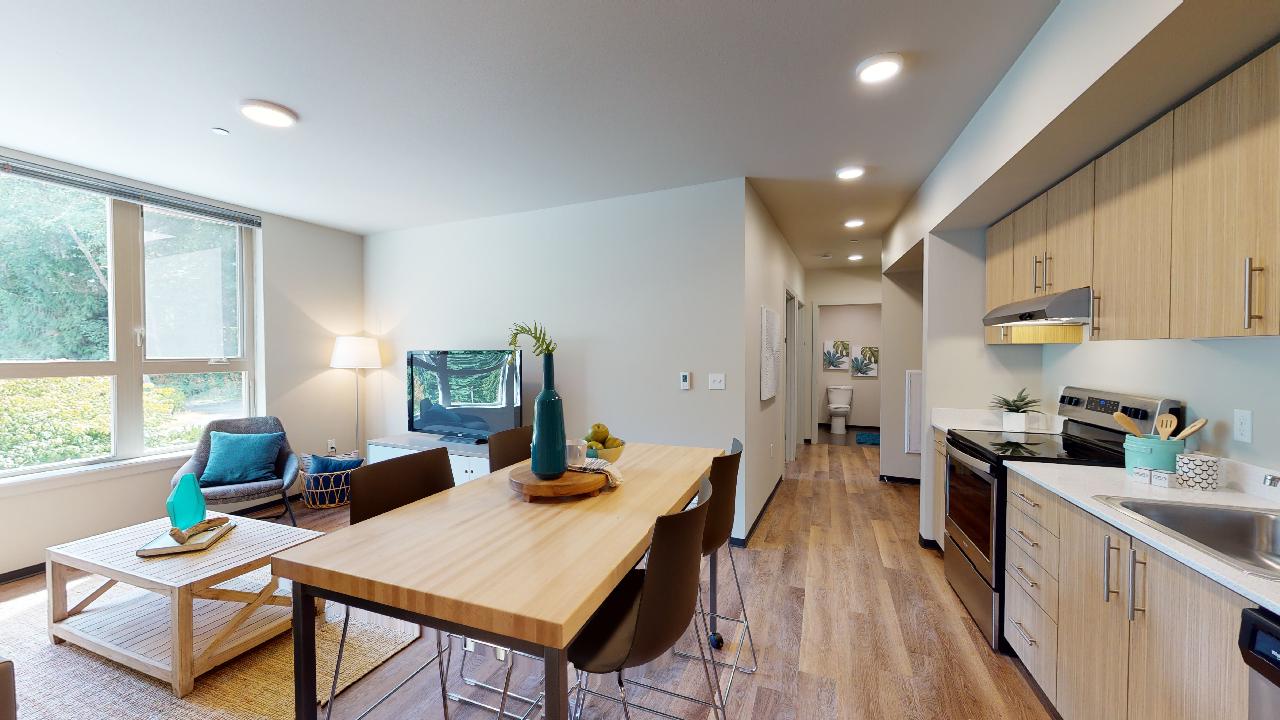 Modern kitchen with wood flooring and ample light - SCC campus apartments